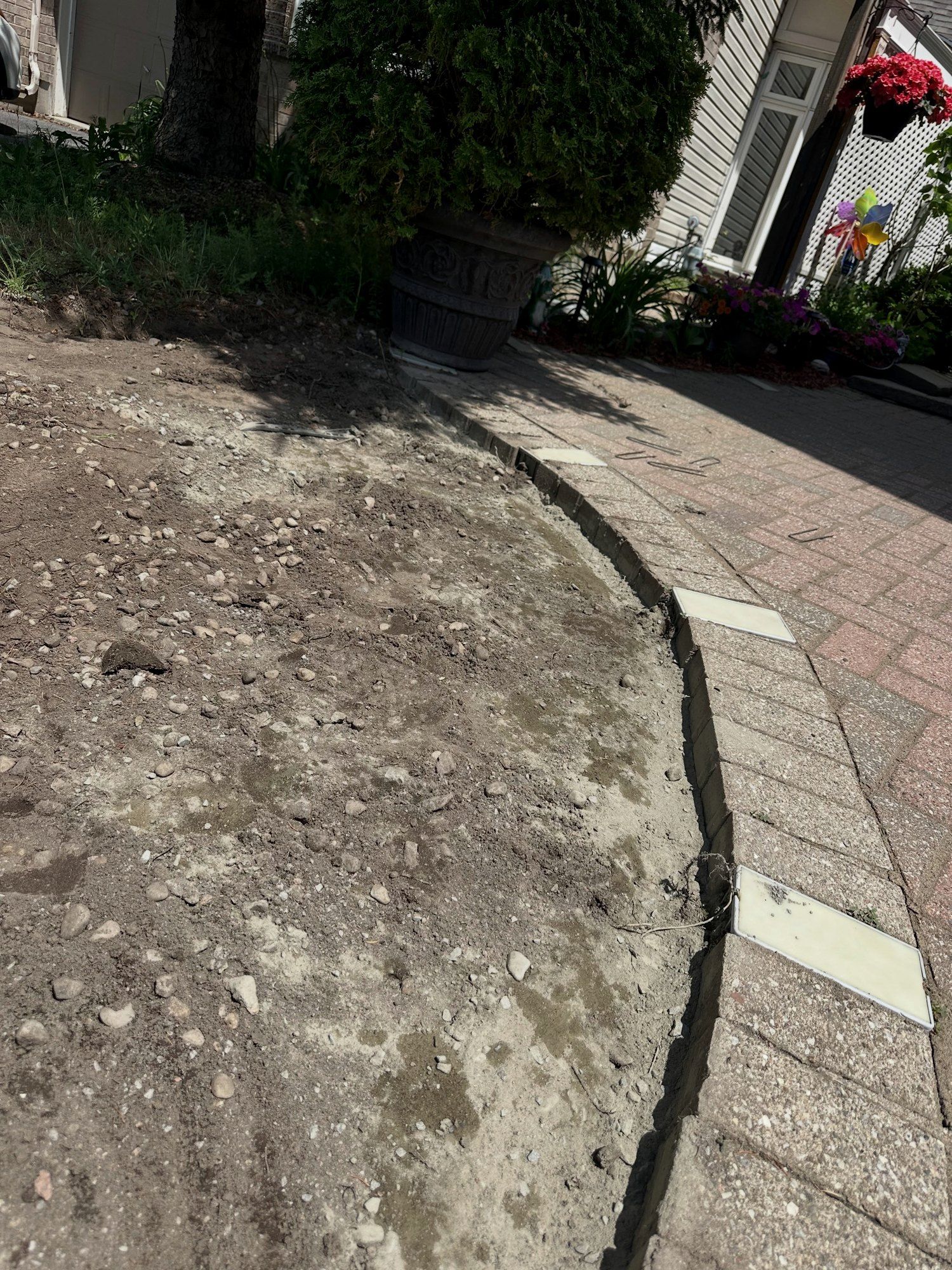 Before: Front garden bed and paver edge