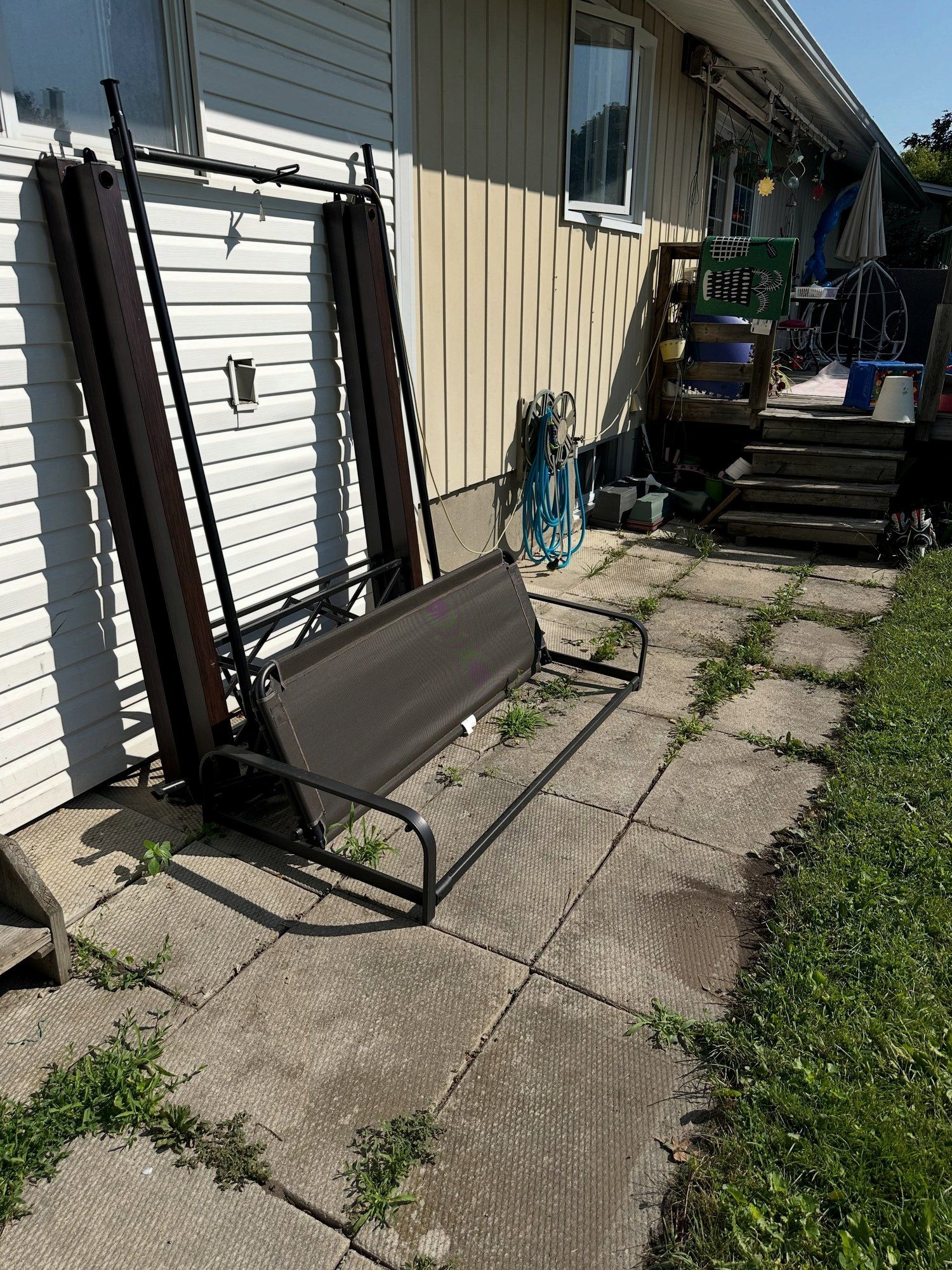 Before: Side-yard drainage along the foundation