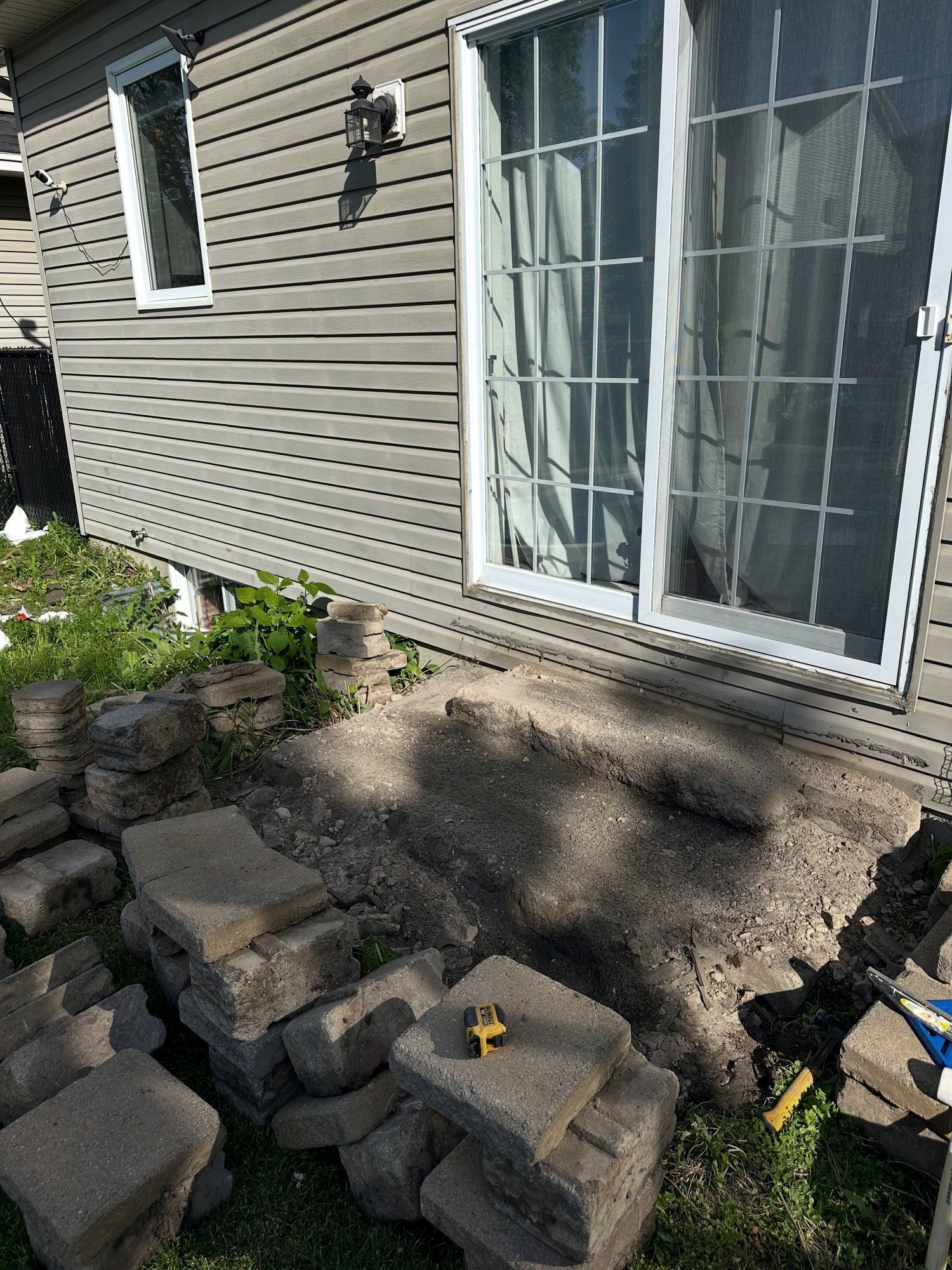 Before: Rear patio-door steps rebuilt