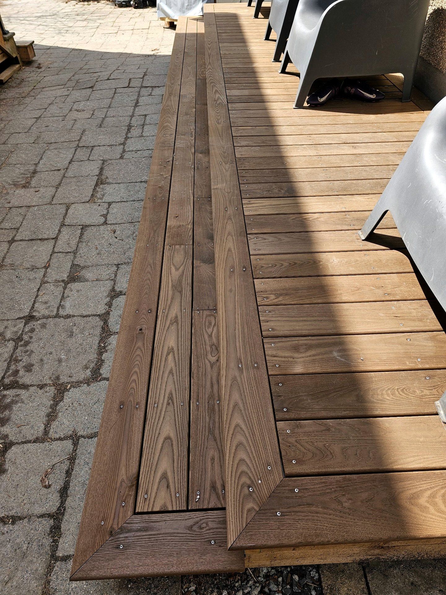 Picture-frame border where the deck meets the interlock