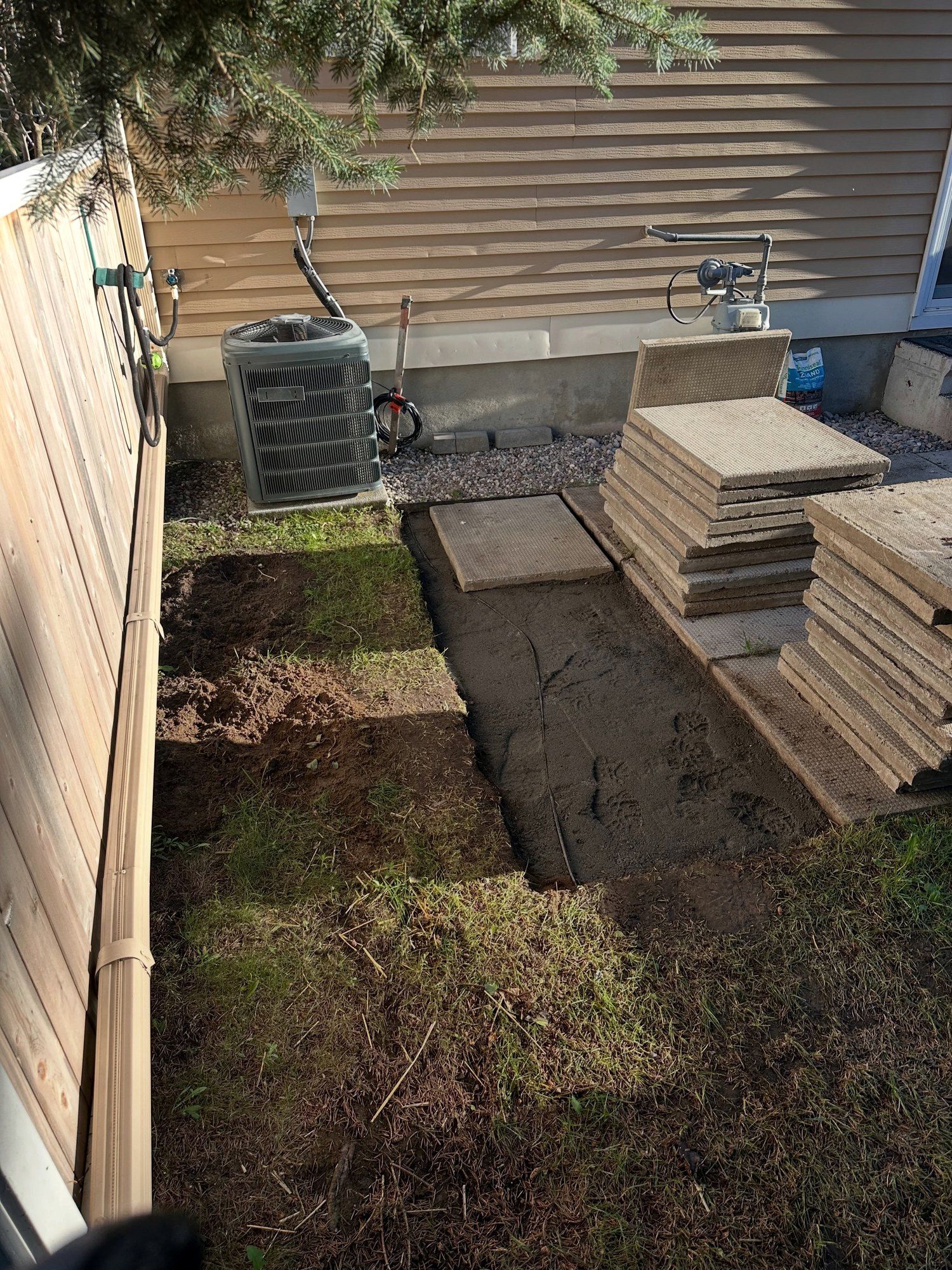 Lawn strip dug out beside the old patio