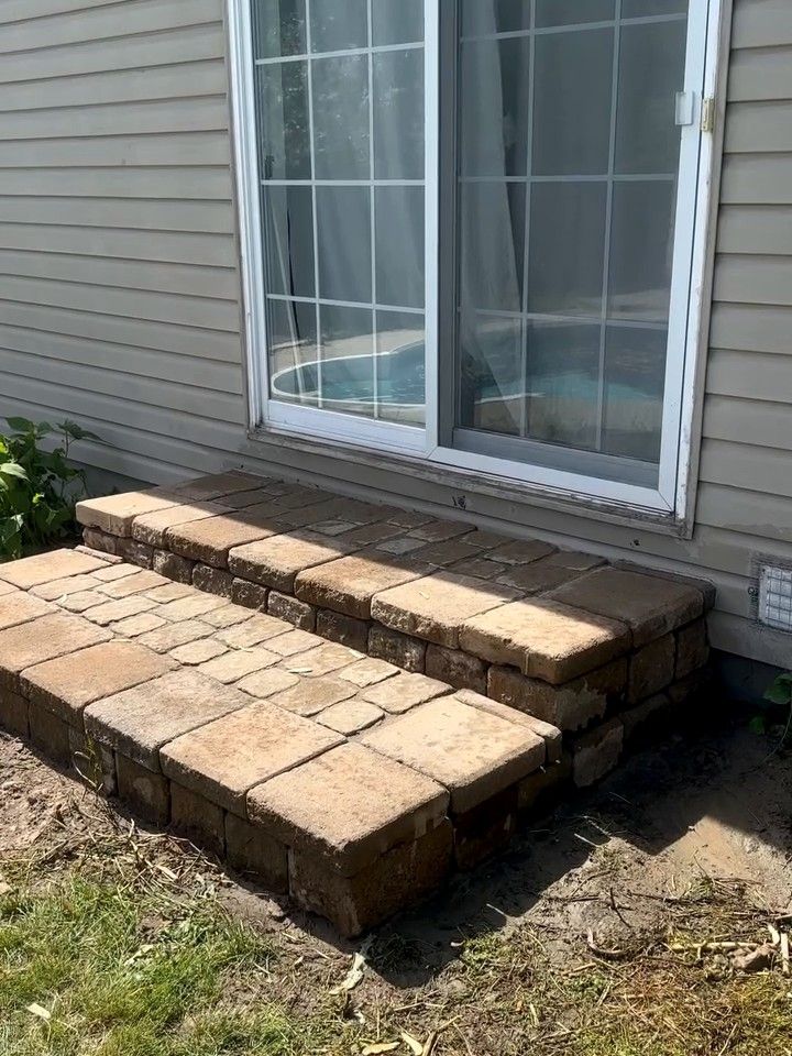 Rebuilt segmental block steps at a patio door