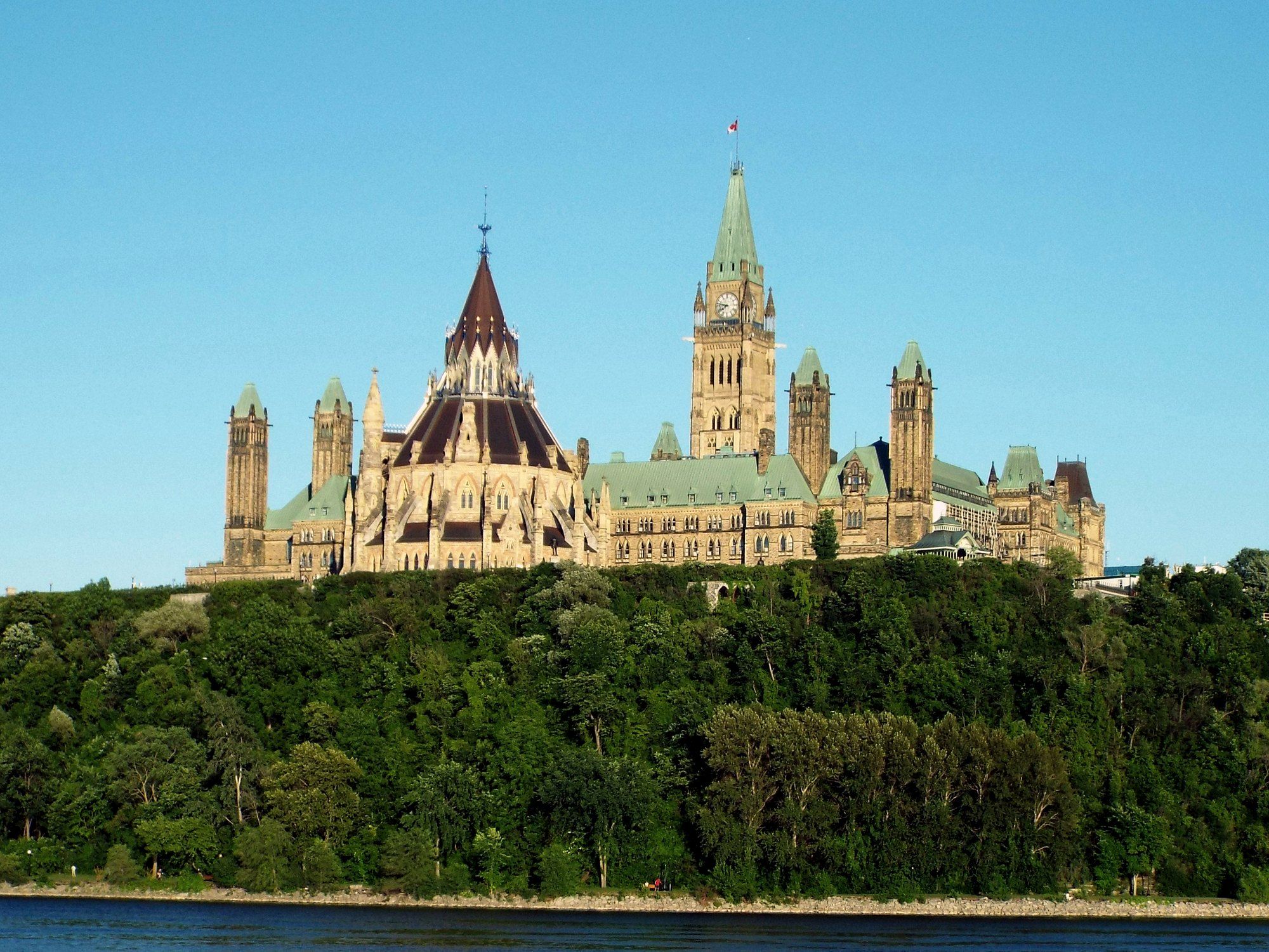 Parliament Hill above the Ottawa River on a summer evening