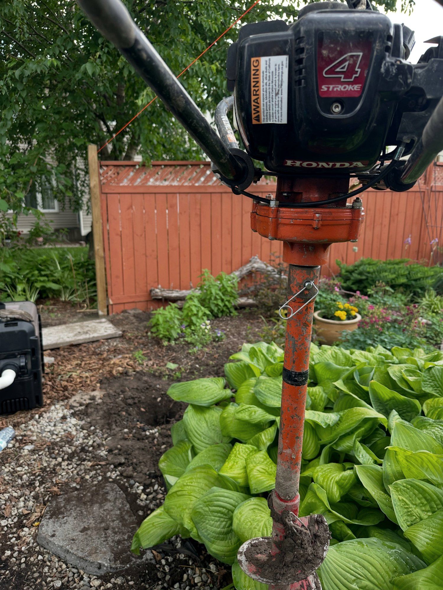 Post holes drilled with a power auger