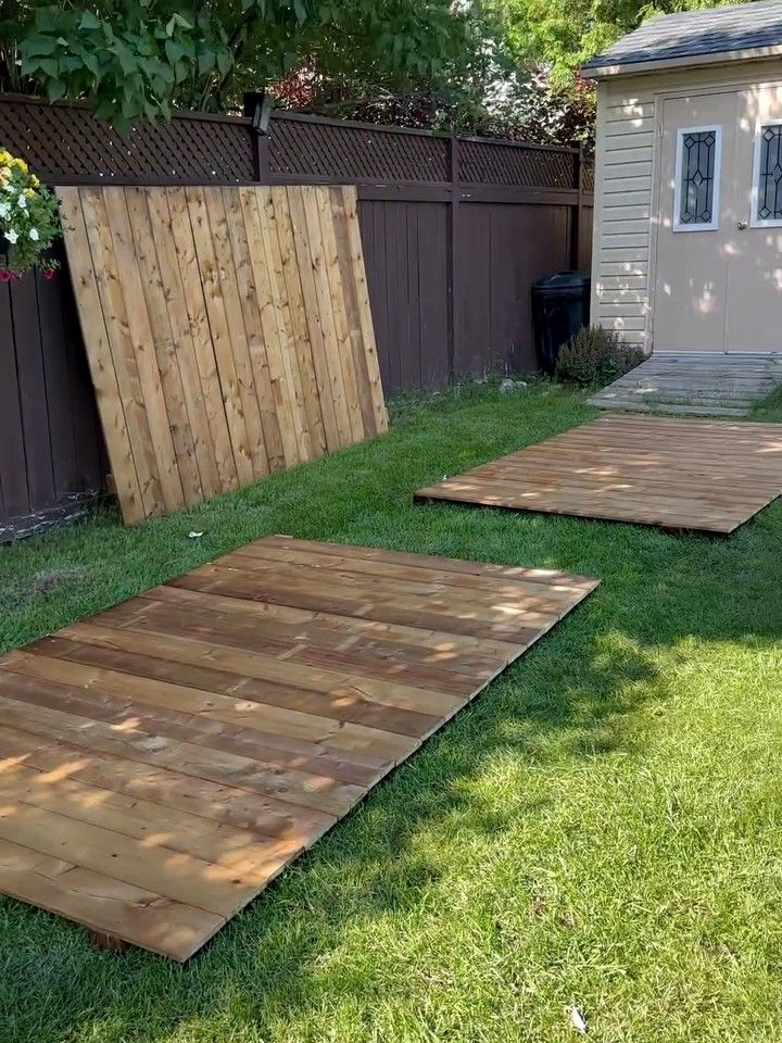 Fence sections built on the lawn before hanging